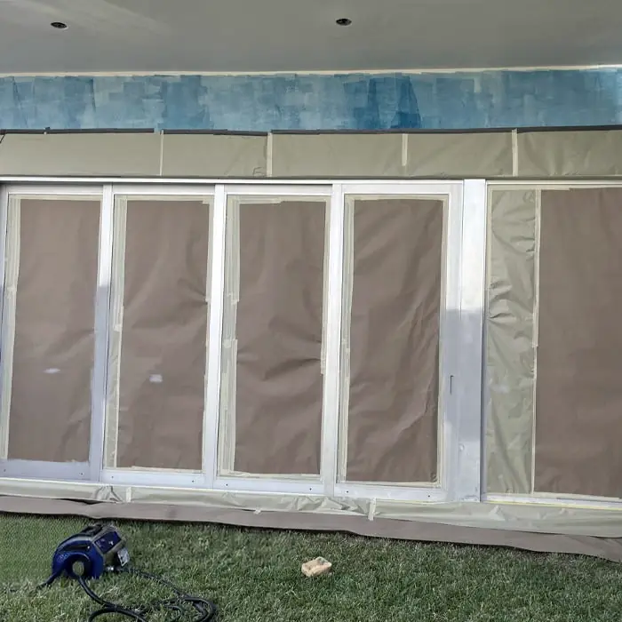 Window frames masked before painting